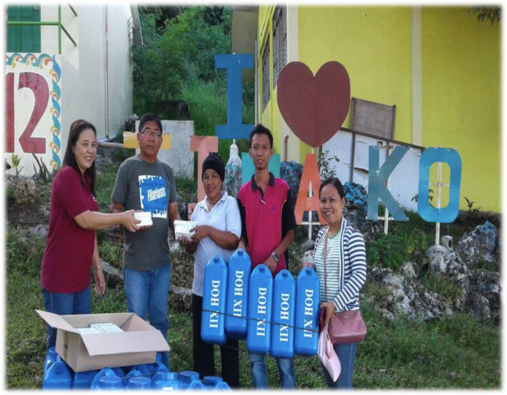 15 water containers and a hundred boxes of water purifiers were distributed. From L-R: Lorelie Panganiban, Francisco Papa, Consmarie Guillen, Ricky Carolasan, and Jeannie Baroro