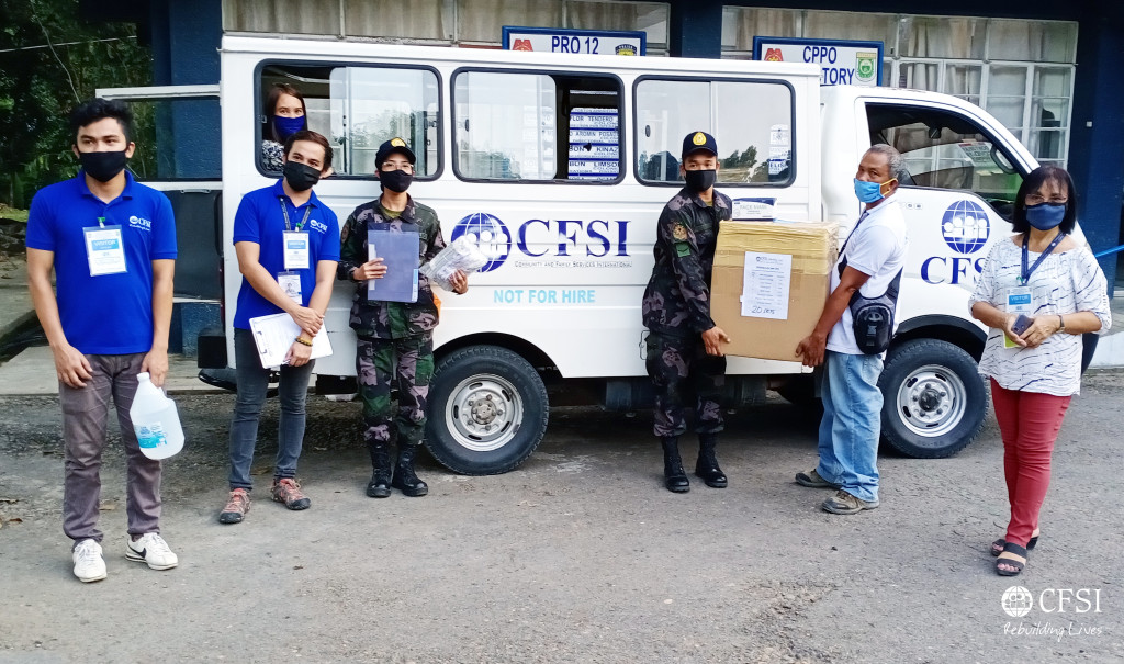 CFSI staff members hand over basic protective and disinfectant materials to Cotabato Police Provincial Office on 5 May 2020.